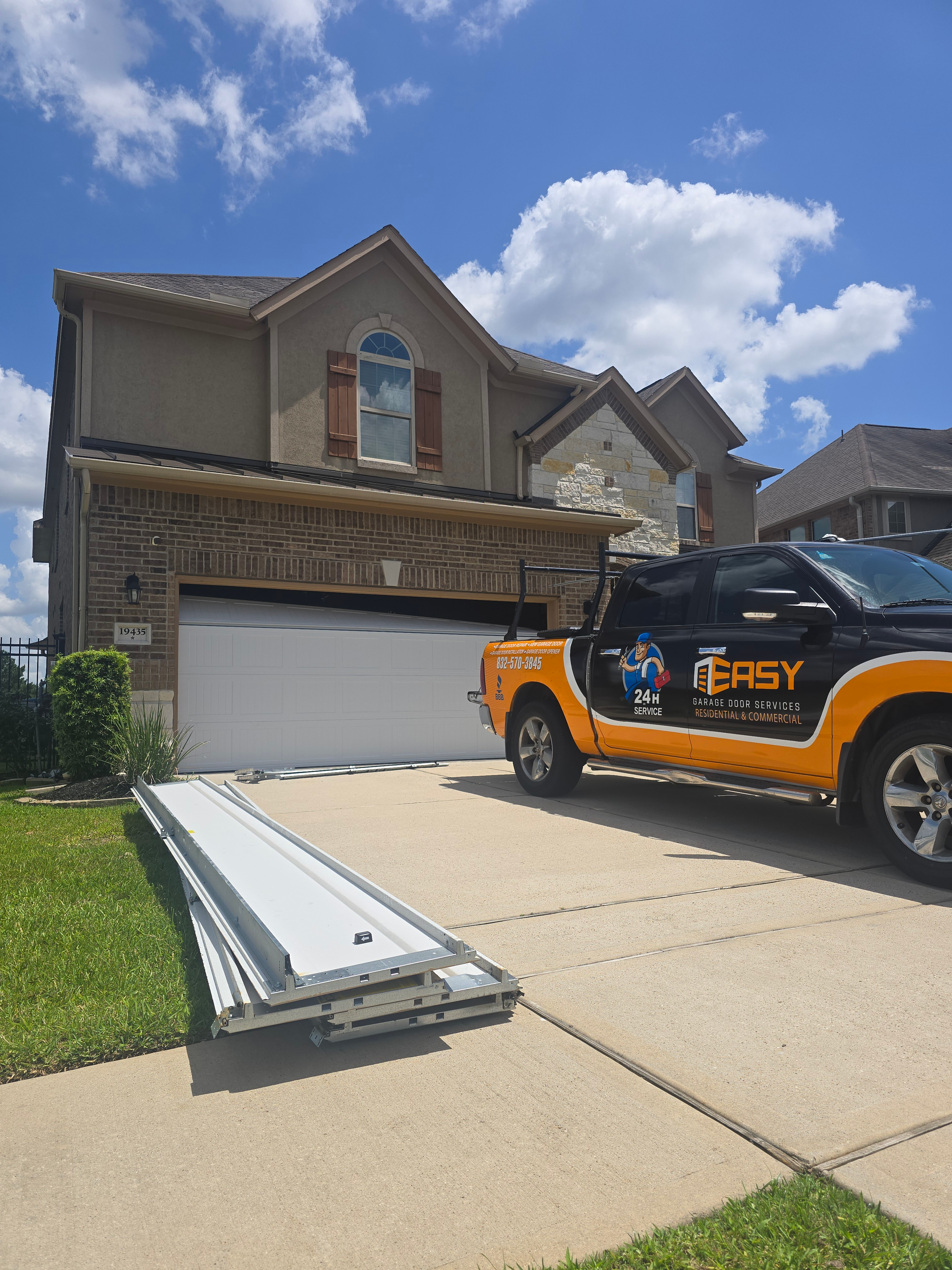 Easy Garage Door Repair truck in a Houston neighborhood