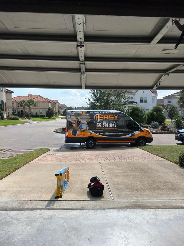 Easy Garage Door service van at a Houston home