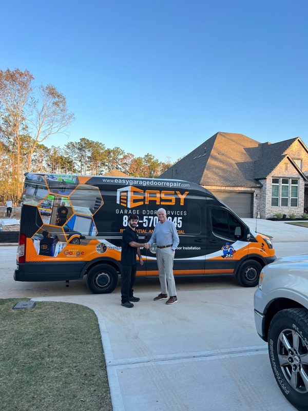 Easy Garage Door tech with customer at the truck